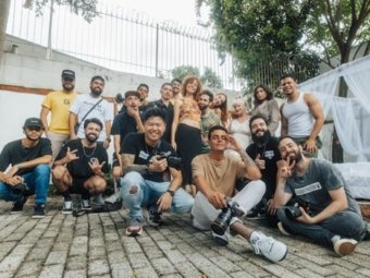 Diverse group of friends having fun and posing for a group photo outdoors in São Paulo.