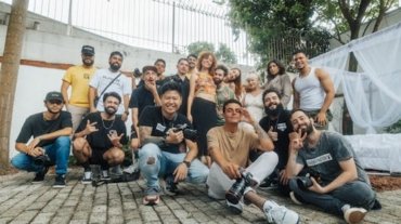Diverse group of friends having fun and posing for a group photo outdoors in São Paulo.